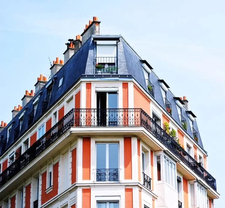 Elegant Parisian-style residential building with wrought-iron balconies